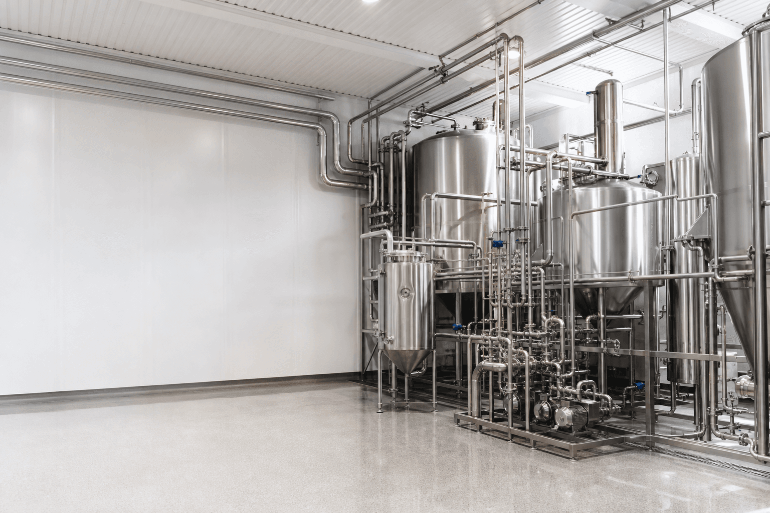 Stainless steel process vessels and piping inside a clean production hall